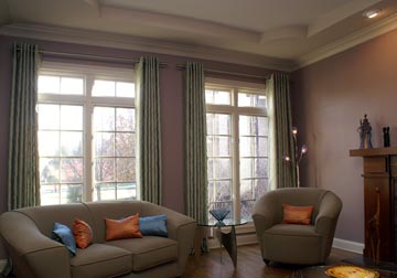 custom window treatments with drapery panels and grommets and Busche rods in Glenview by Spiritcraft Interior Design in Crystal Lake and Barrington, Illinois